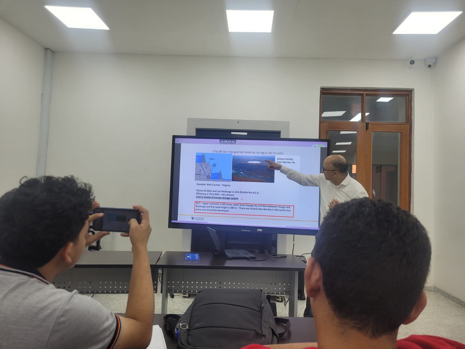 José Nelson Angulo Argote lecturing on pumped hydro storage, presenting one of the world's largest water batteries