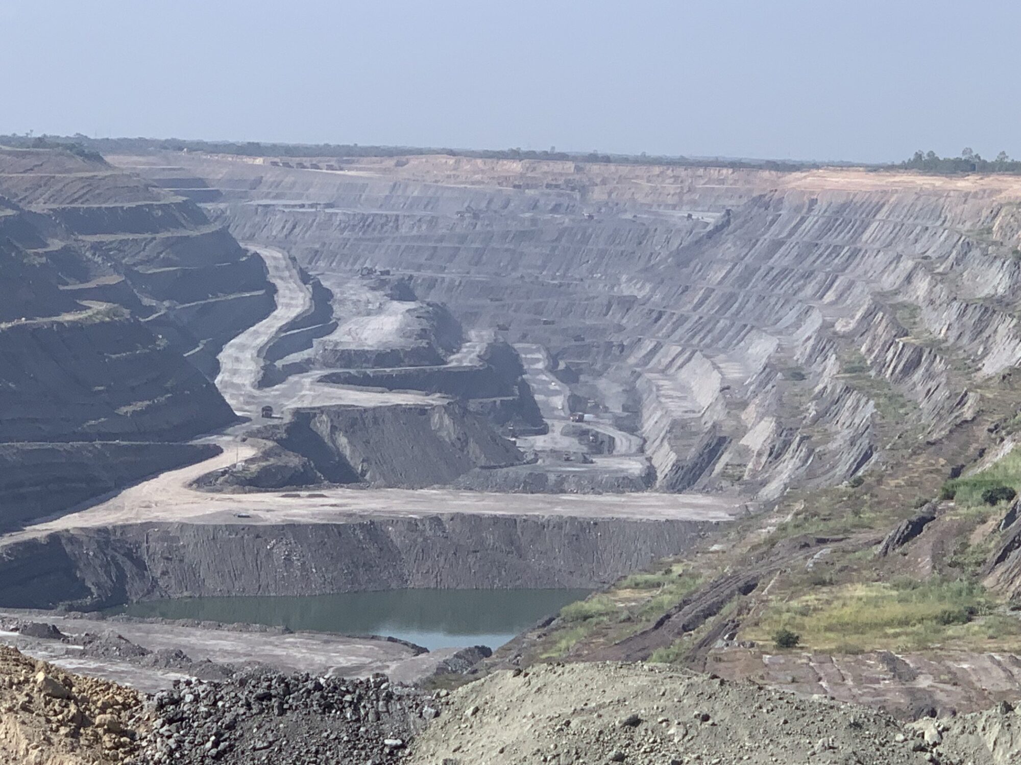 Open-pit mine in Cesar, Colombia, with water collecting at the bottom of the pit